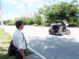 Elder Crocker watches a tricycle for unexpected happenings.