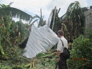 Elder Cabeza took a picture of Elder Crocker looking at Typhoon Glenda damage